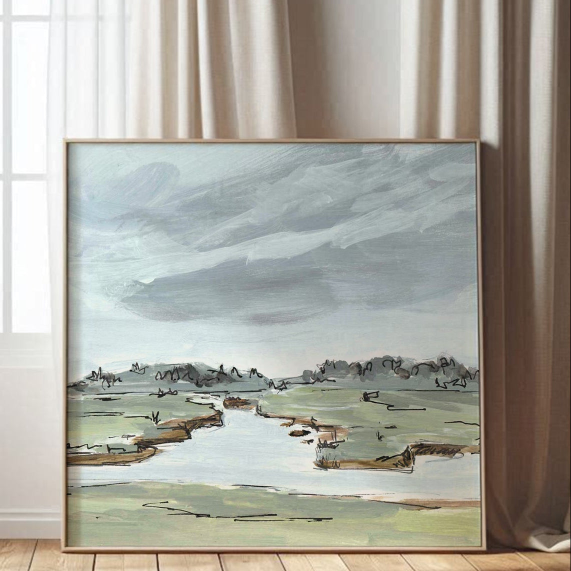 Framed landscape painting on a wall with curtains and wooden floor.