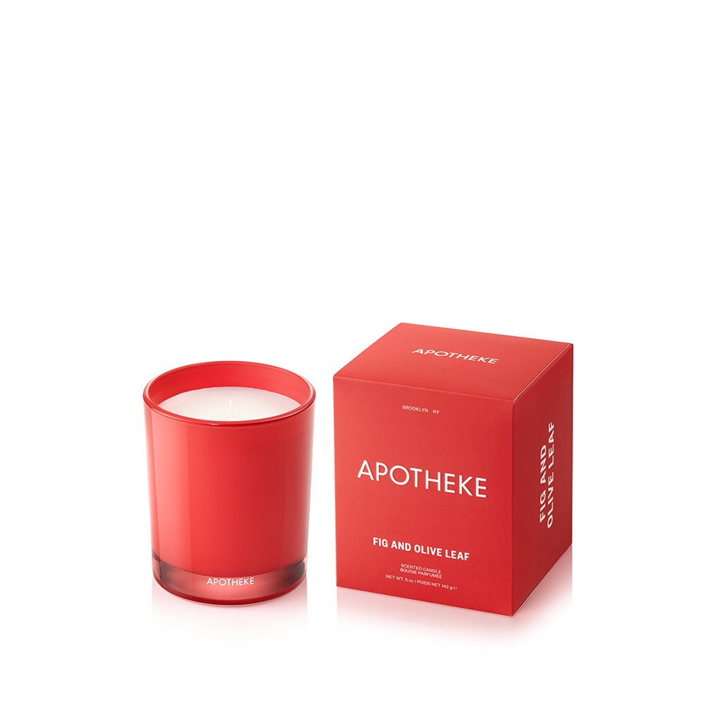 Red candle and box with 'Apotheke' Fig And Olive Leaf branding on a white background