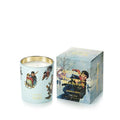 A light blue scented candle with a gold-rimmed glass vessel and winter-themed illustrations, shown next to its matching illustrated packaging box on a white background.