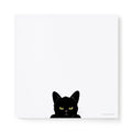 Felix Doolittle square notepad featuring a Black cat with yellow eyes peeking over the bottom of the pad on a white background