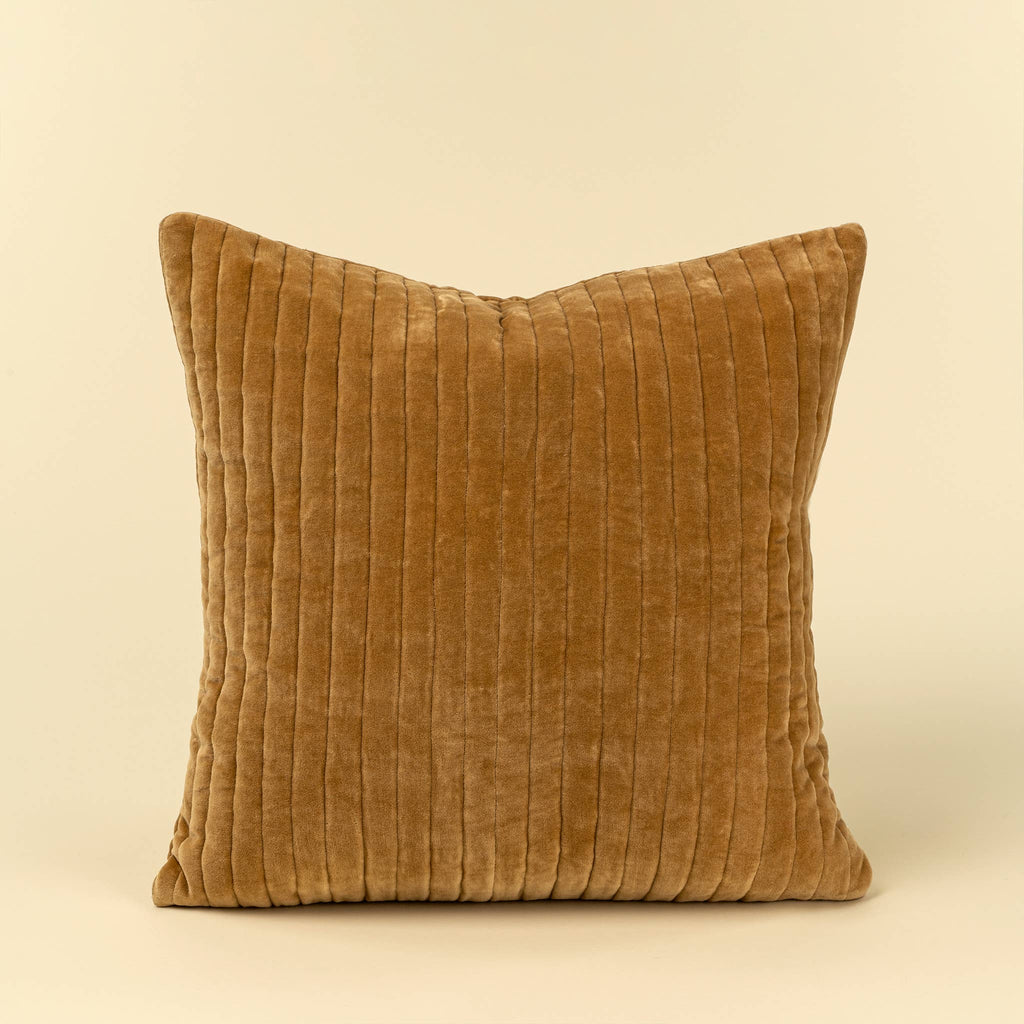 A square throw pillow in a warm camel brown corduroy fabric, shown against a solid cream background.