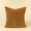 A square throw pillow in a warm camel brown corduroy fabric, shown against a solid cream background.