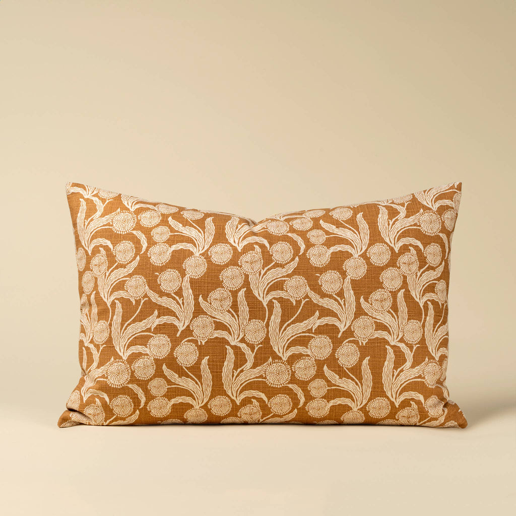 Decorative pillow with floral pattern on a beige background