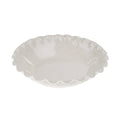 White ceramic Calypso serving bowl with scalloped edge on a white background