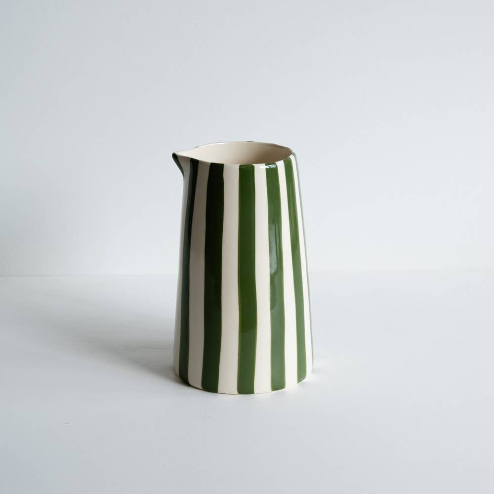 Moss green and white striped ceramic jug. Each jug is hand painted so the lines may not be perfectly straight, adding to the charm of the piece. 