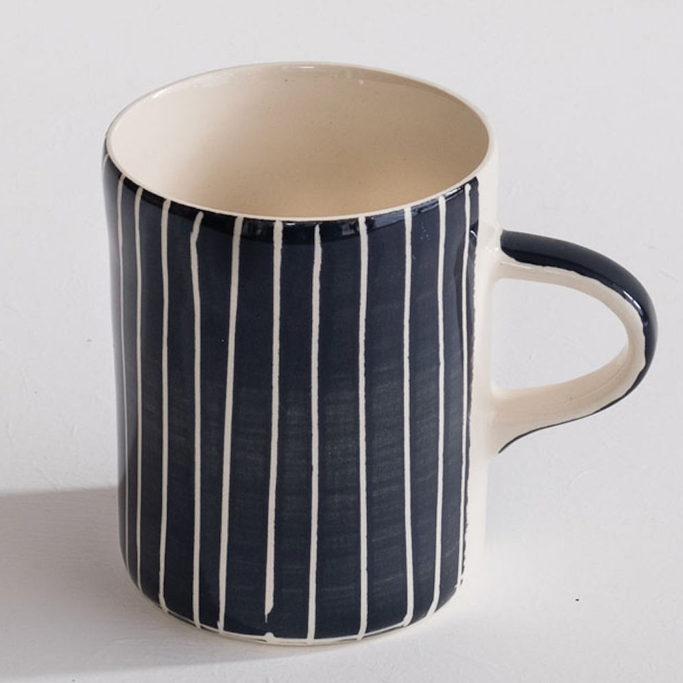 Musango Blue & White striped ceramic mug. Each mug is hand-painted, so the stripes may not be straight, adding to the charm.