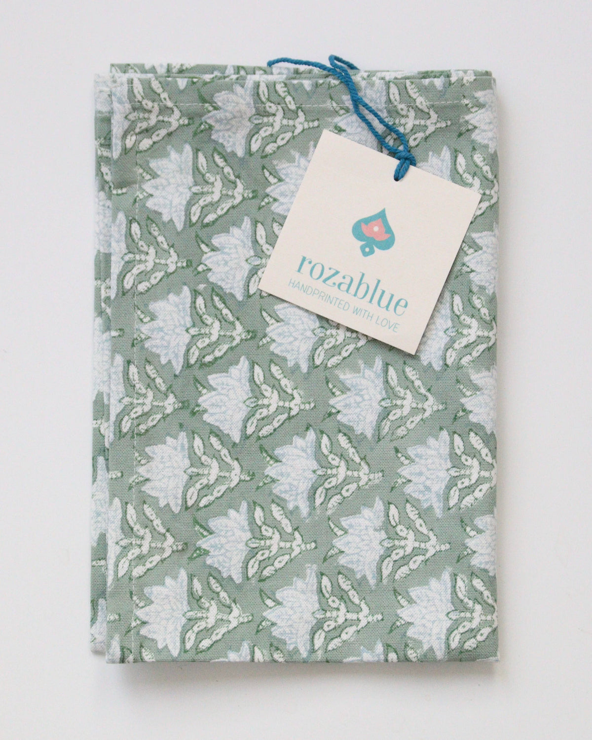 Block Print Patterned tea towel or dish towel with a visible brand tag on a white background