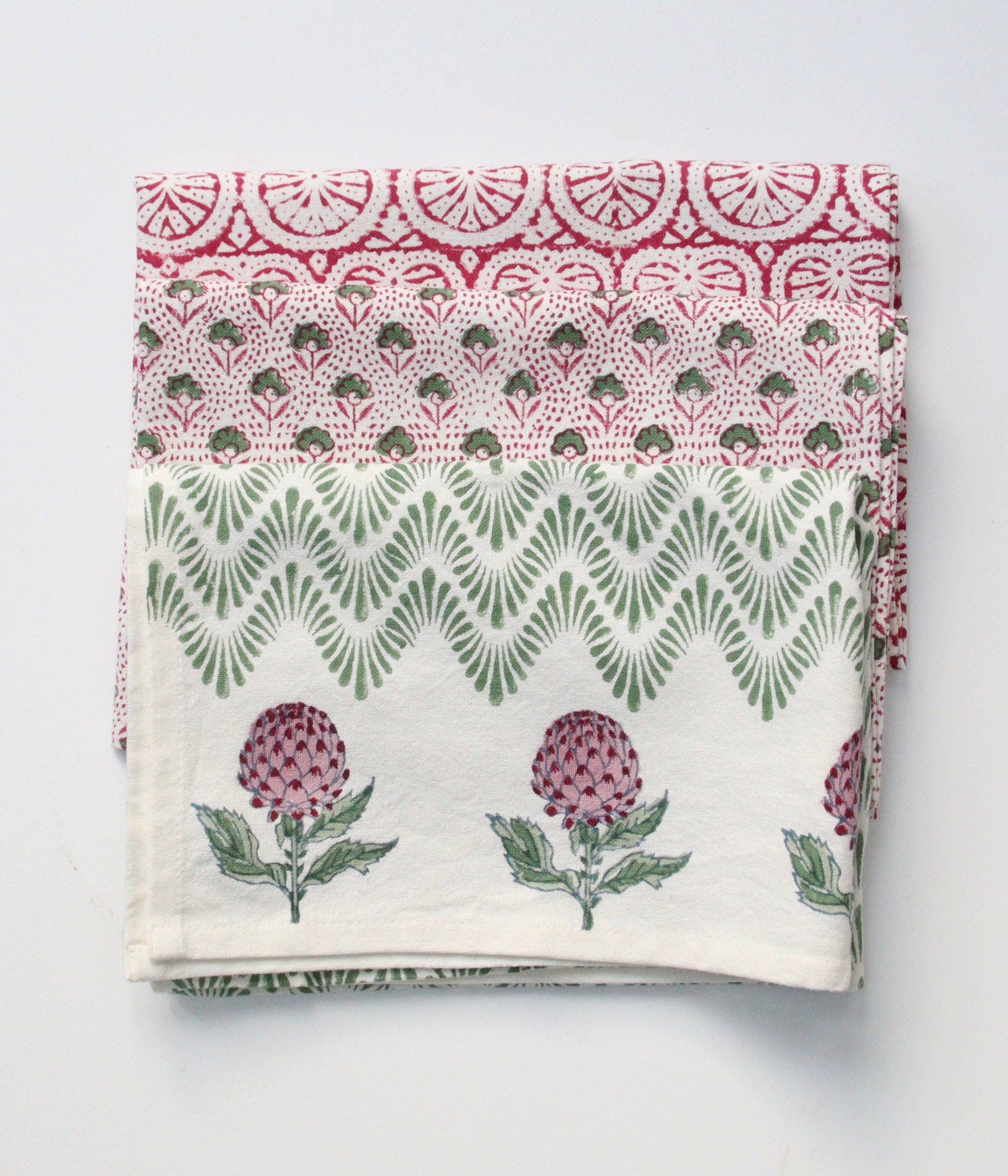 Cotton Hand towels with floral and geometric patterns on a light gray background