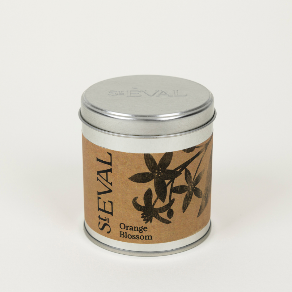 Candle tin labeled 'St Eval Orange Blossom' on a white background