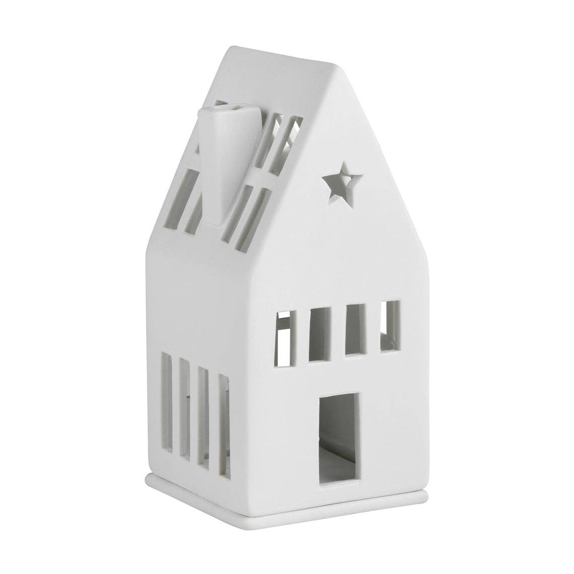 White house-shaped tea light holder with star design on a white background
